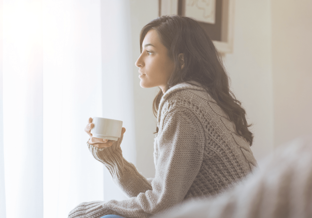 how to unplug - woman thinking with cup in hand