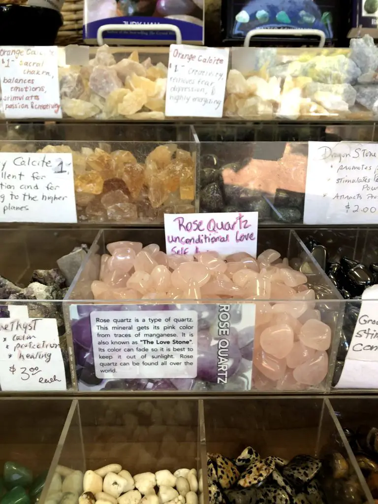 Rose quartz crystal polished form in specialty shop.