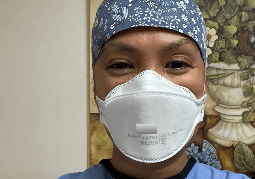 Blog author in mask and scrubs
